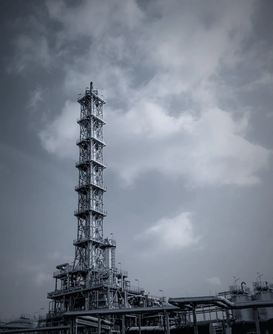 A drill rig mast against open sky