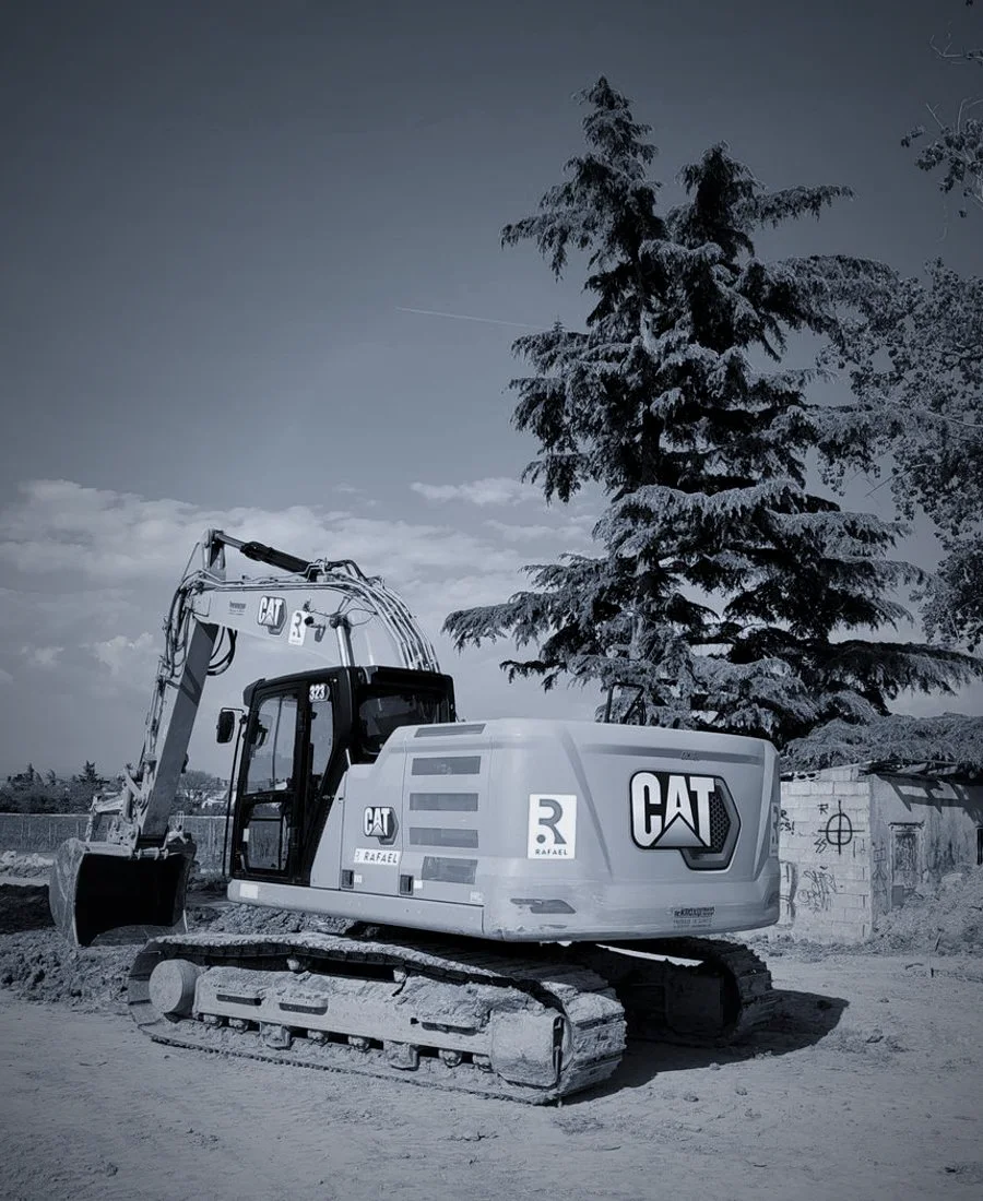 A tracked excavator working broken rock