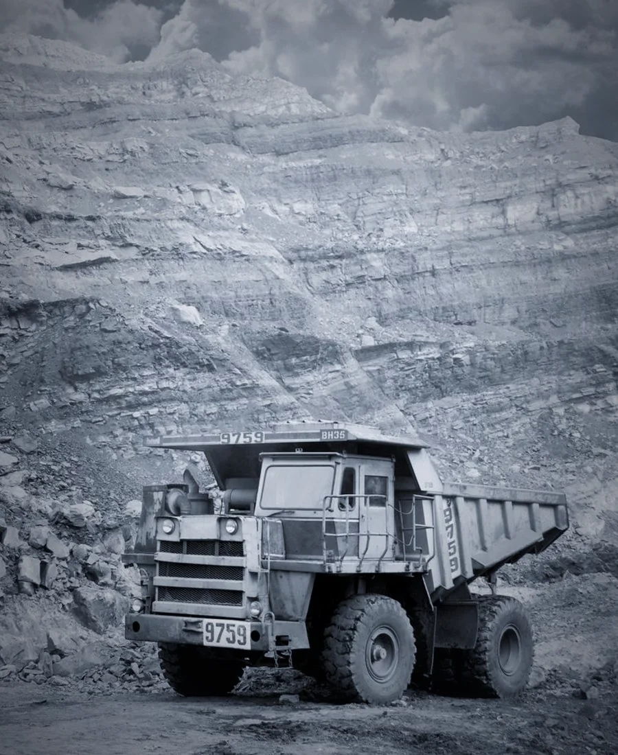 A rigid haul truck on a mine bench