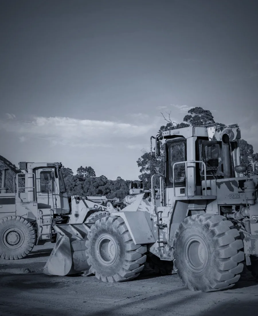 A wheel loader lifting a full bucket