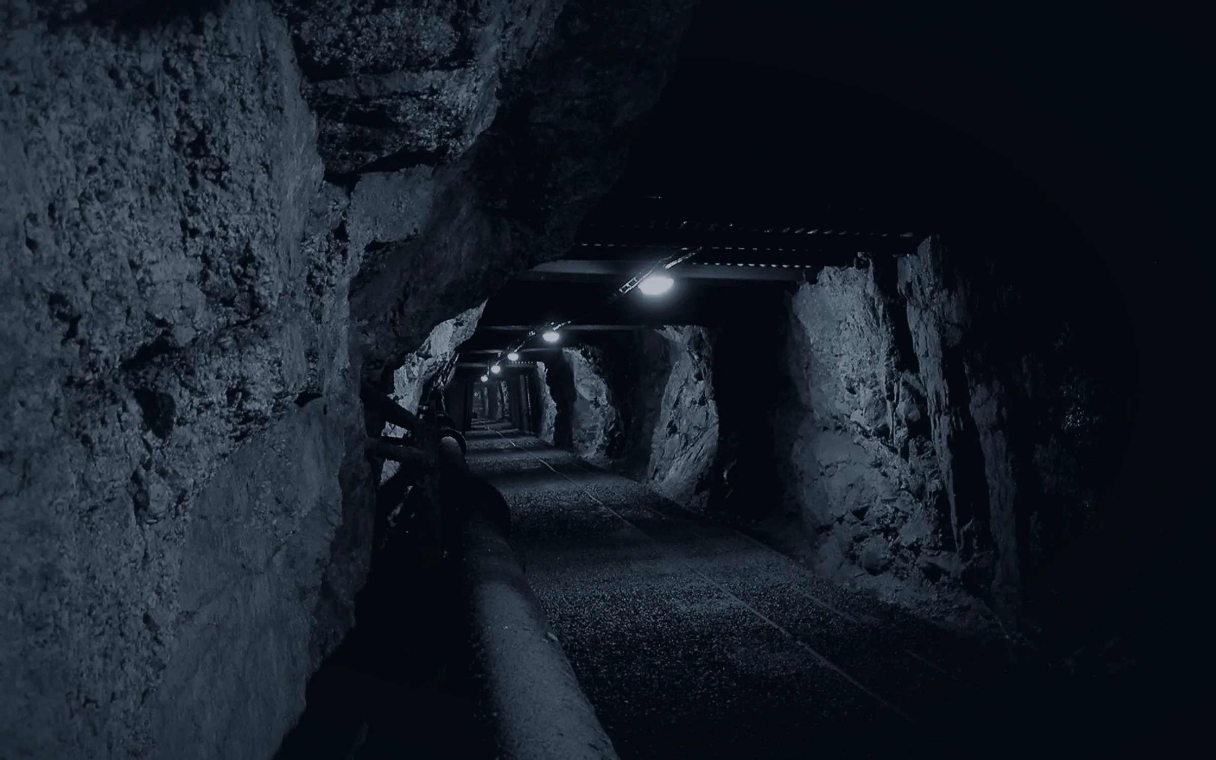 A lit tunnel leading further underground